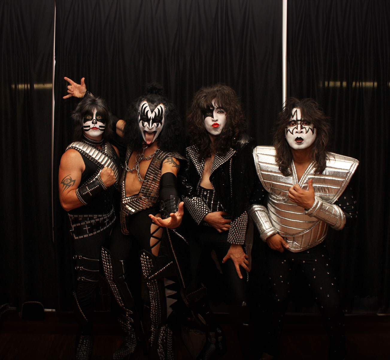 A photo of the members of KISS Nation, a Kiss Tribute act. The four band members are dressed like the members of the band KISS, with their signature makeup. KISS Nation will be performing at the 2024 Dutchess County Fair.